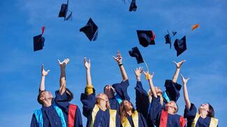 Matric students throwing their hats into the air