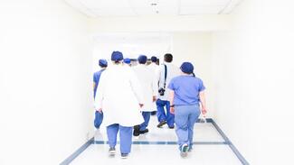 Medical students walking down a corridor