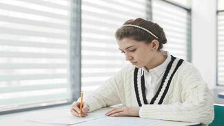 person writing their nbt