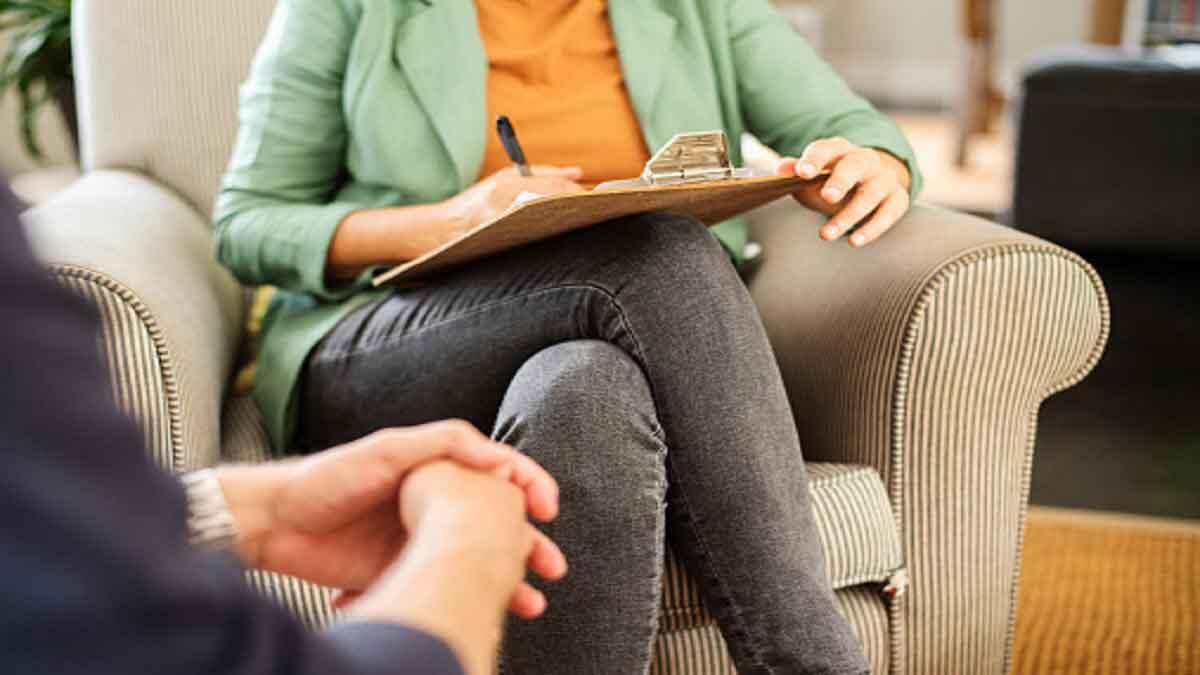 Psychologist counselling with client patient