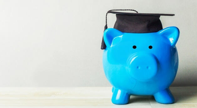 Image of a piggy bank with a graduation cap. 