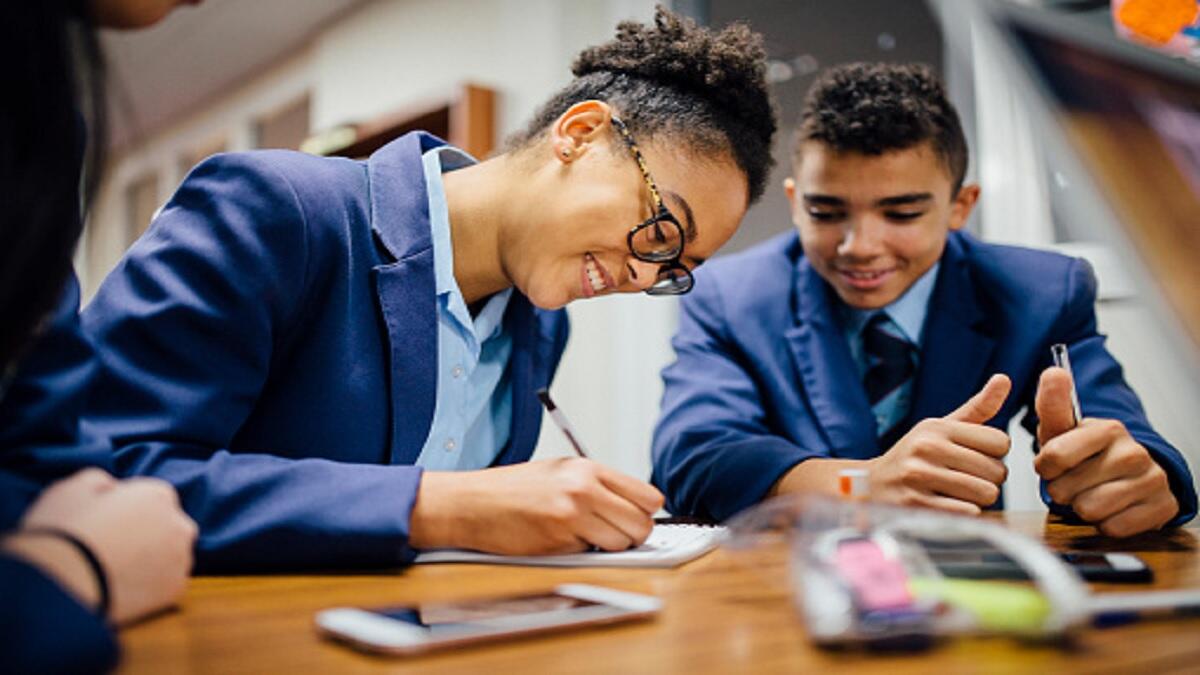 School learners working together in a classroom.