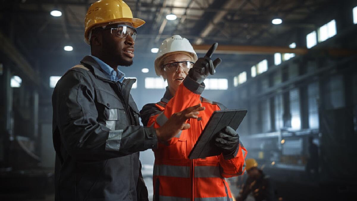 A Health and Safety officer working with a company manager.