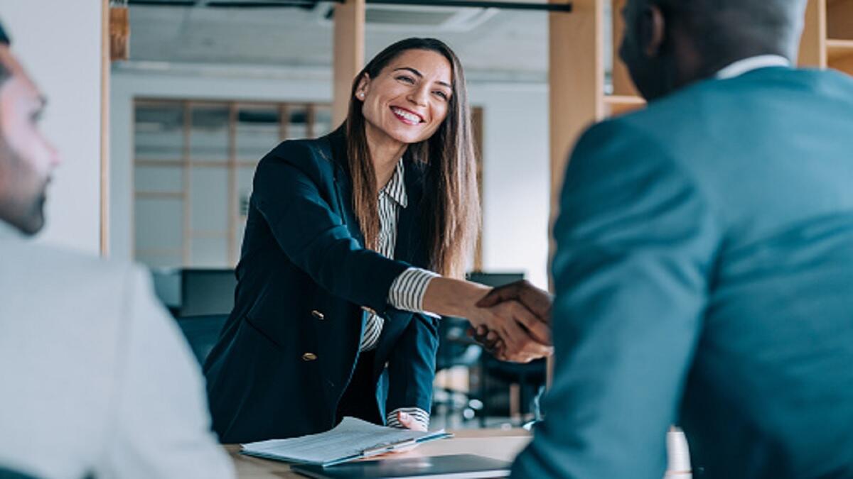 A woman completing a successful job interview.