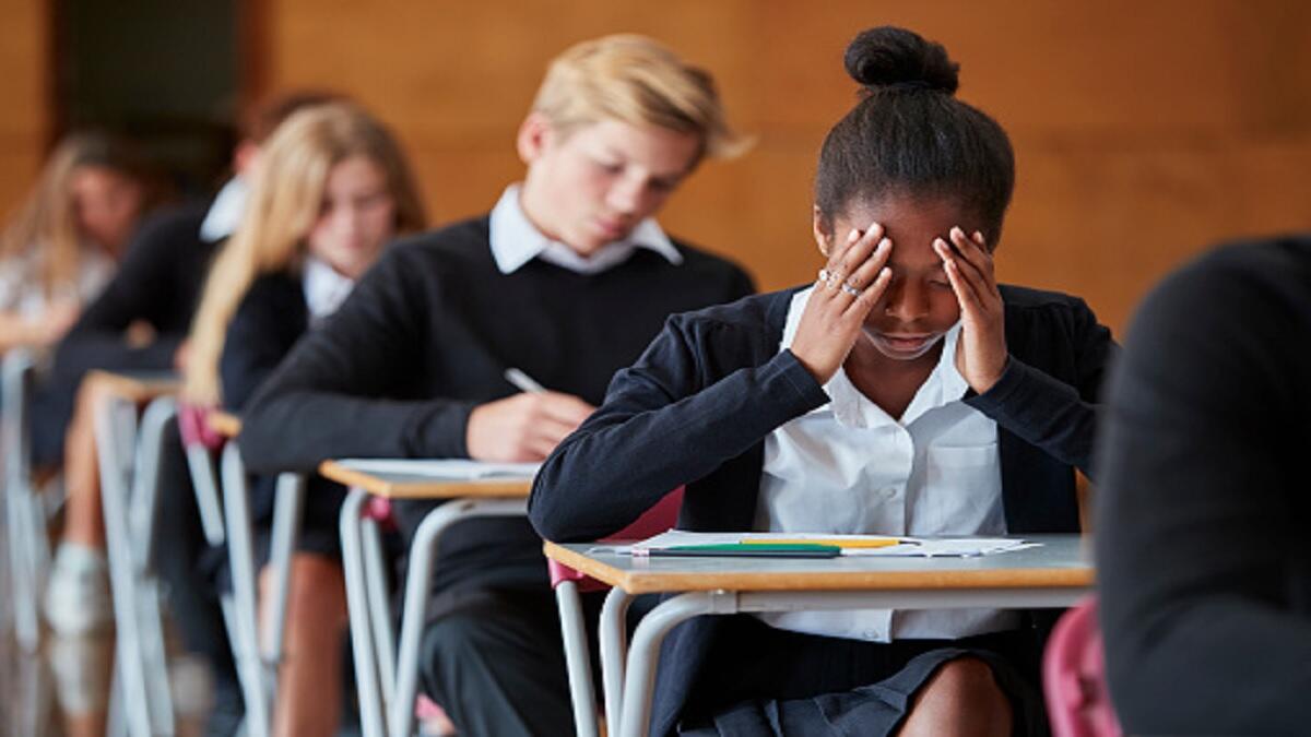 Learners writing an exam.