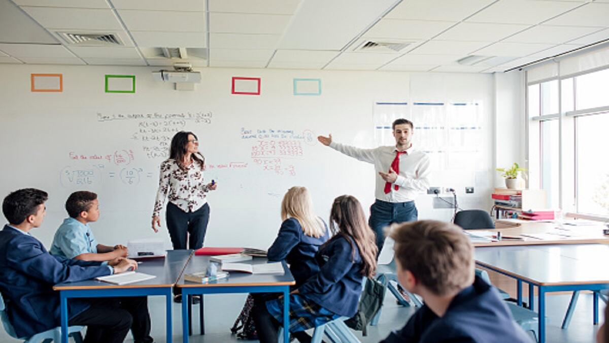 A teaching assistant working in a classroom. 