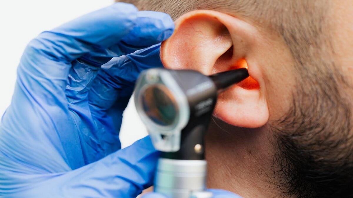 Audiologist assessing patients hearing