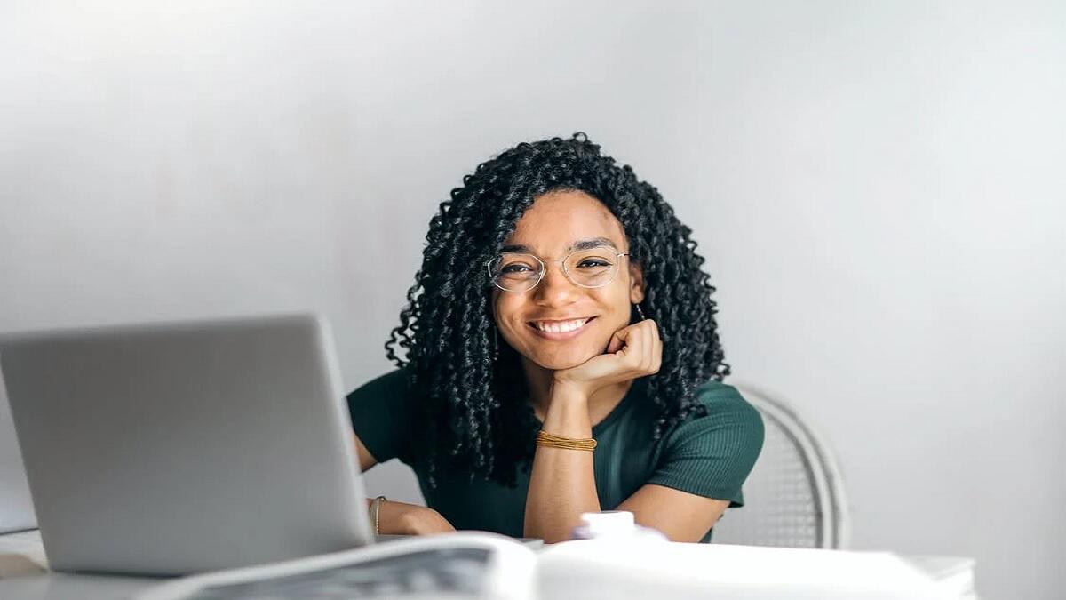 Happy Unisa student starts with online registrations