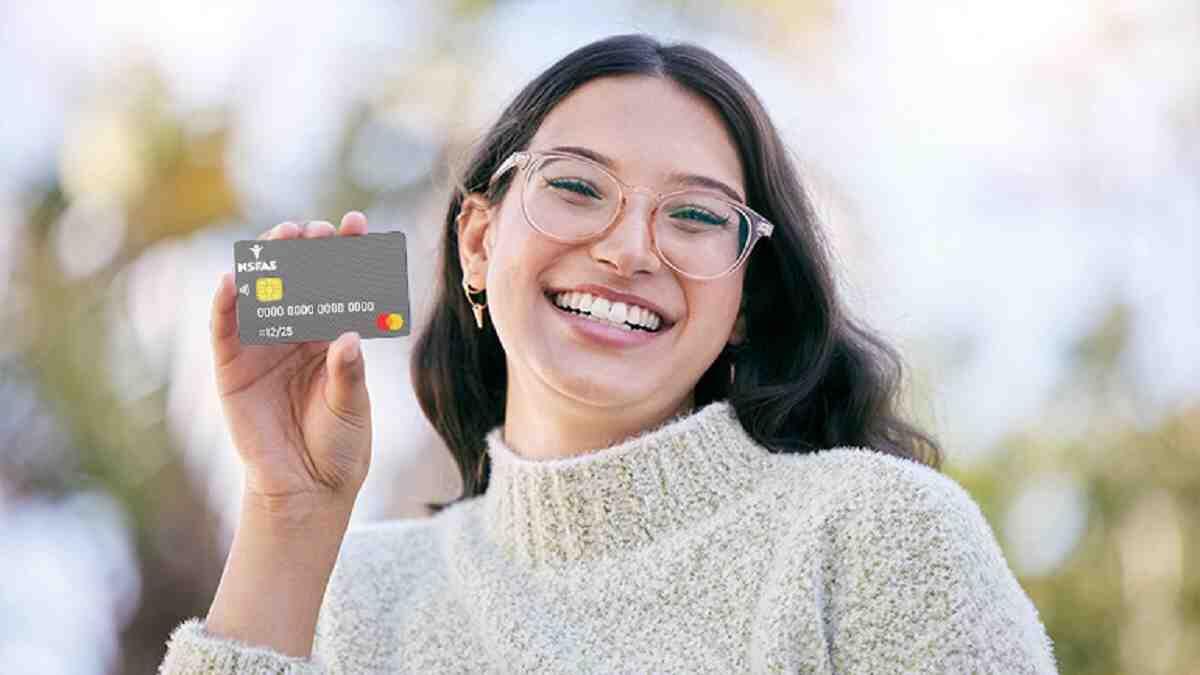 Student holding up new Nsfas mastercard