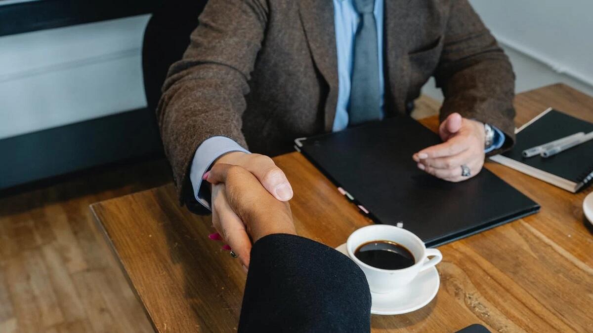 Graduate welcomed by manager in new job