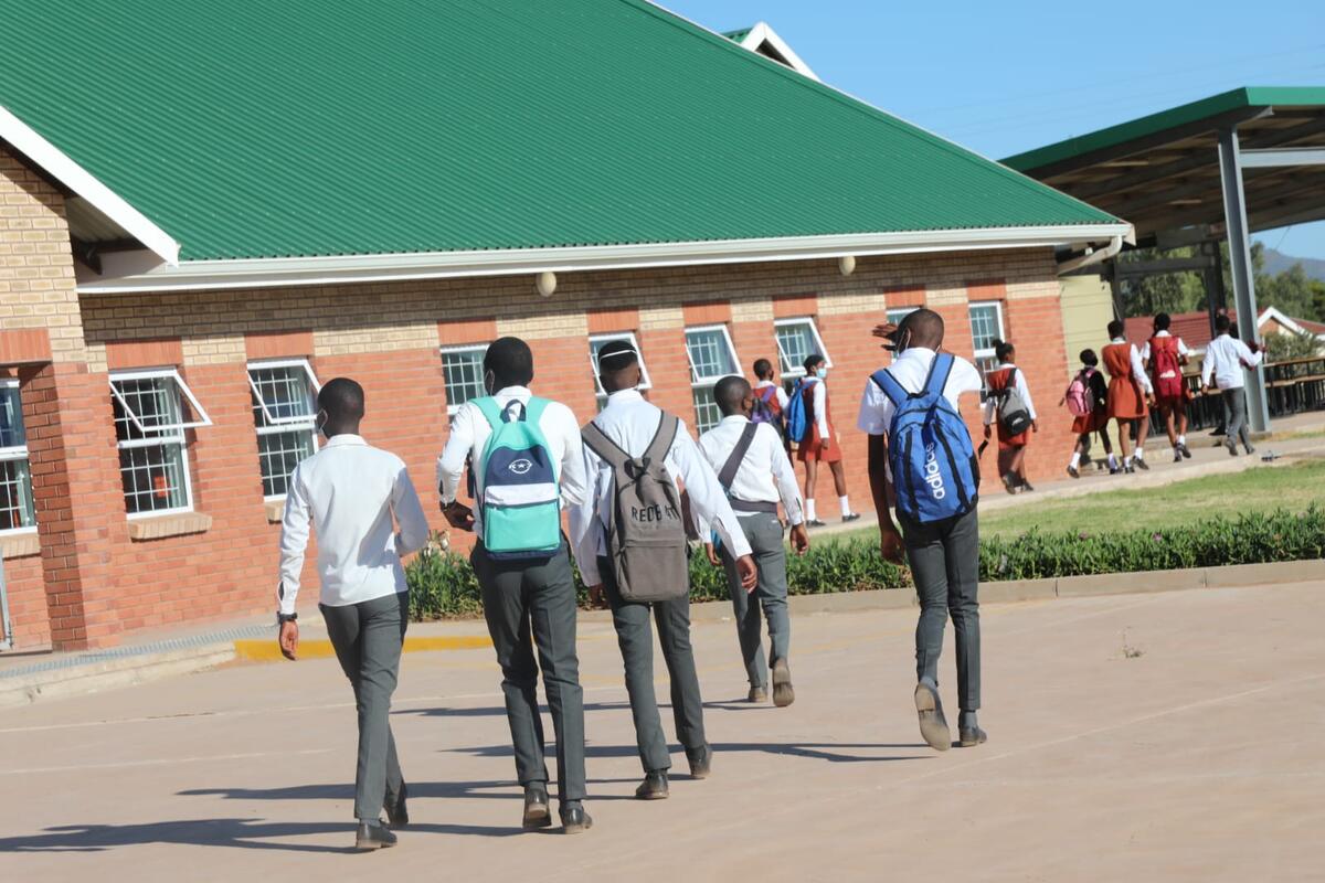 Gauteng grade 8 learners rush to their class 