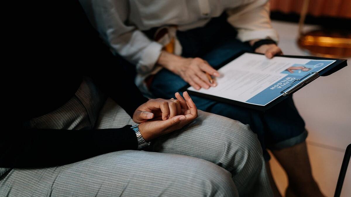 Recruiter going over CV of person looking for a job