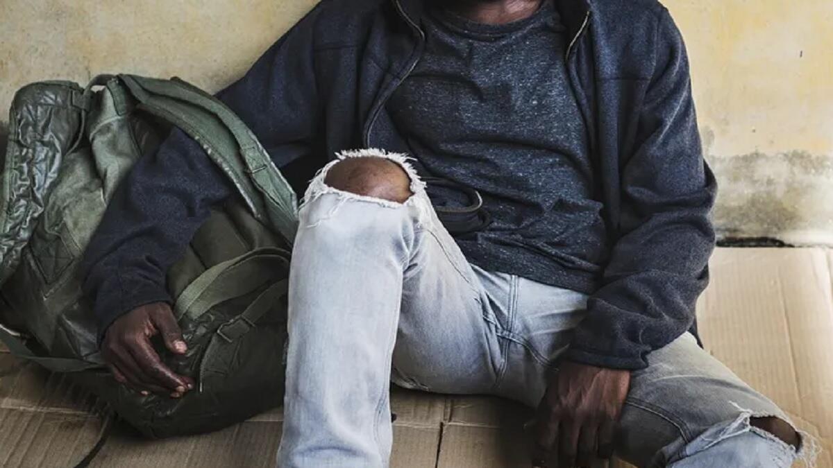 students sits with bags after being evicted from Polokwane Lodge