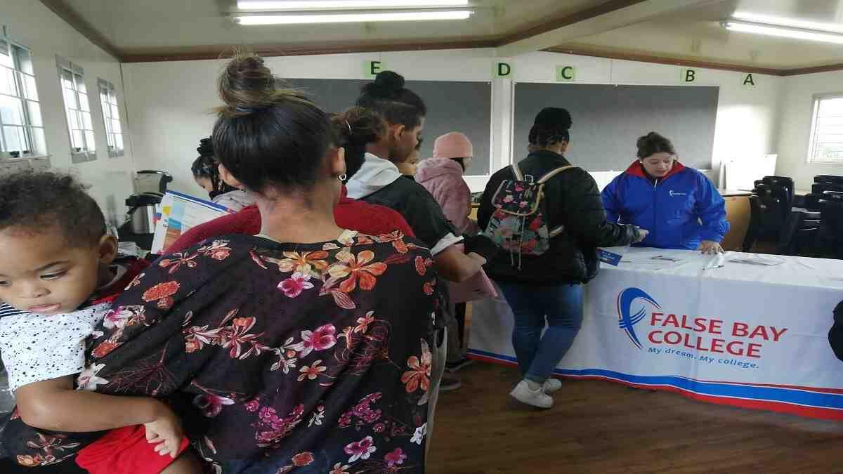 Students standing in a line at False Bay College to apply to the TVET college