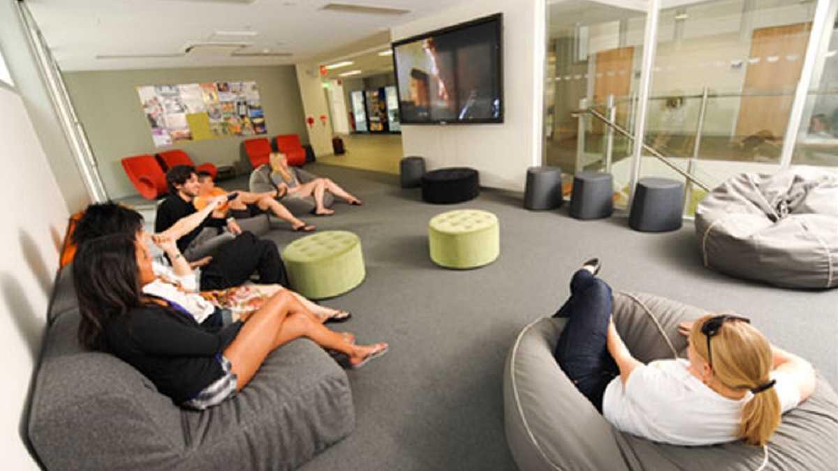 Students sitting in the common area of an off-campus private student accommodation