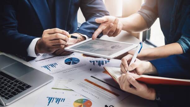 A finance team work together to assess a client's finances