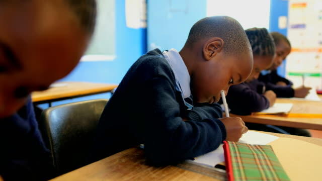 Students admitted to Grade 1 doing classwork
