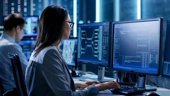 IT professionals do work on their desktops