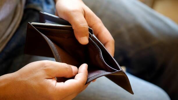 NSFAS private accommodation student opening an empty wallet