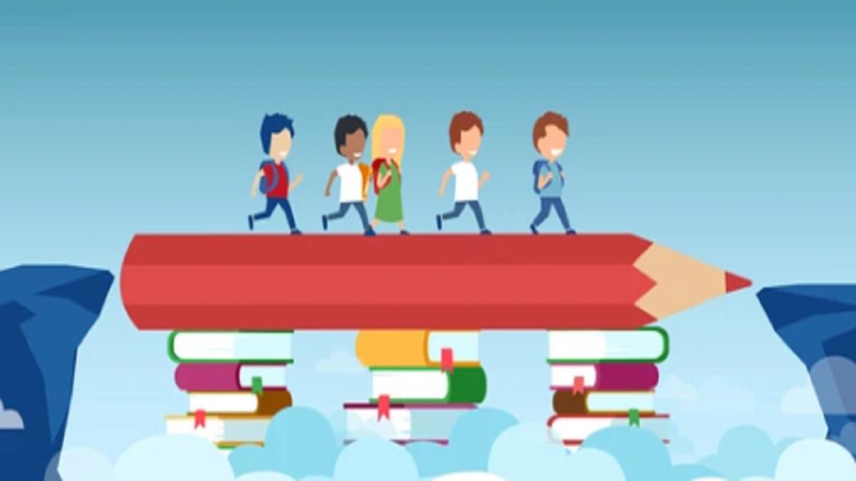 students cross a path that is bridged by books and a pencil