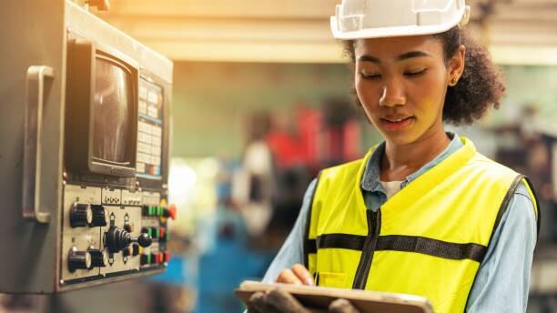 A woman works as an electrical engineer after completing her apprenticeship
