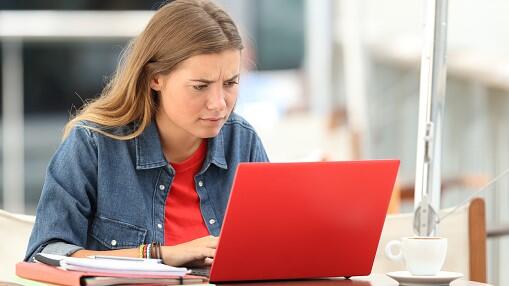 Student reacts to finding out that her short course is unaccredited on her laptop
