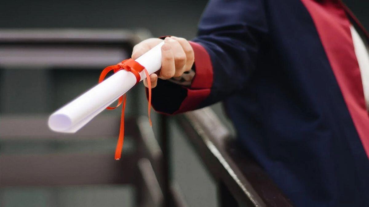 person holding a white scroll