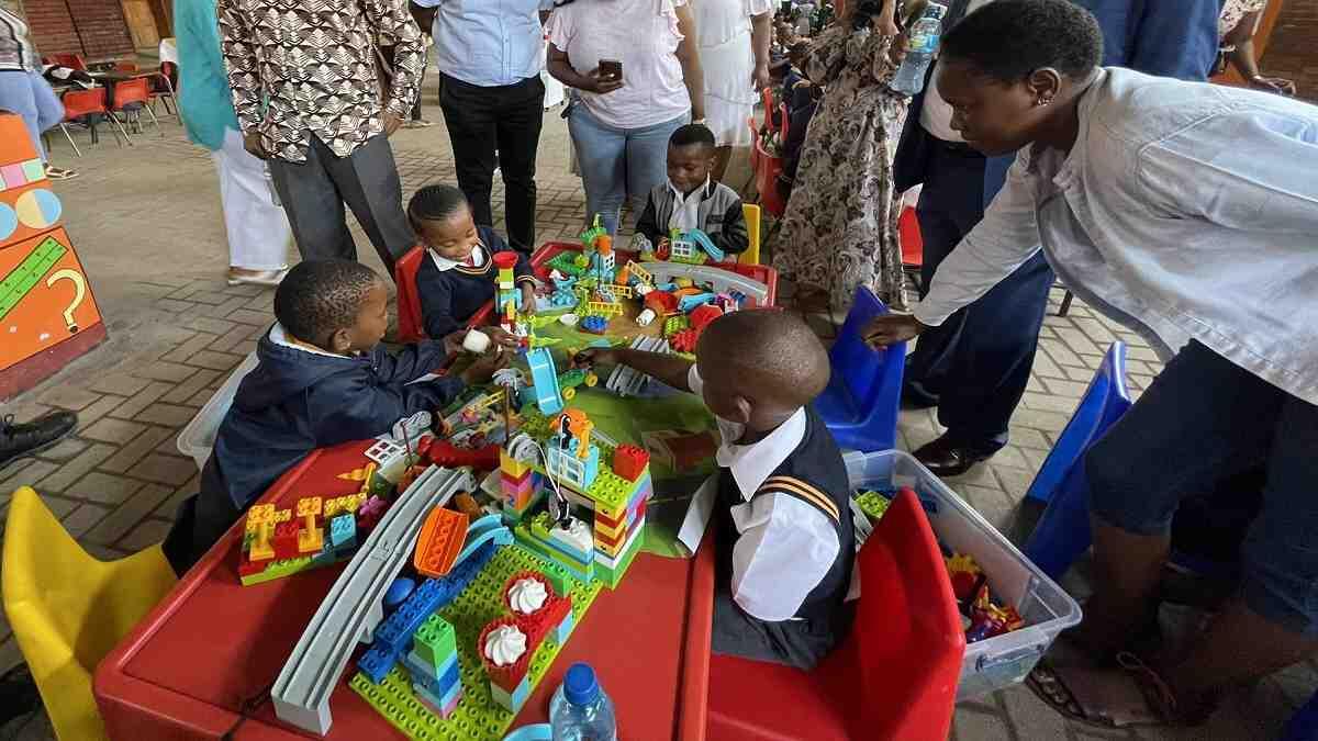 School children playing with legos