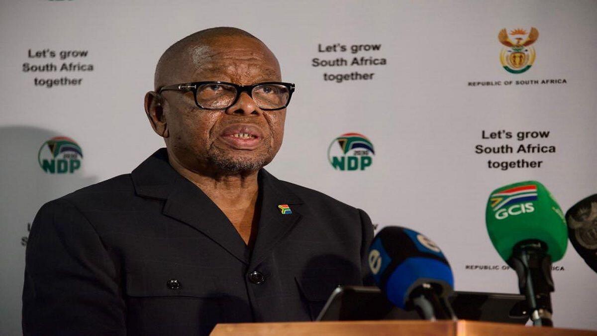 Minister speaking at press briefing