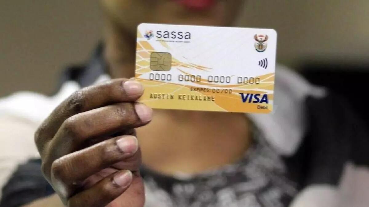 Someone holding a SASSA card