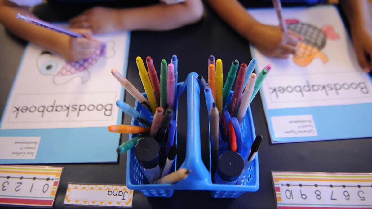 Learners colouring in