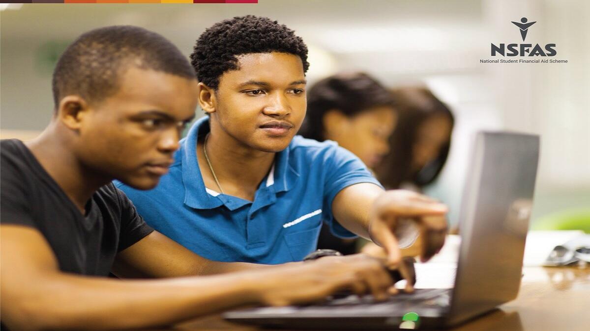 Students in front of laptop