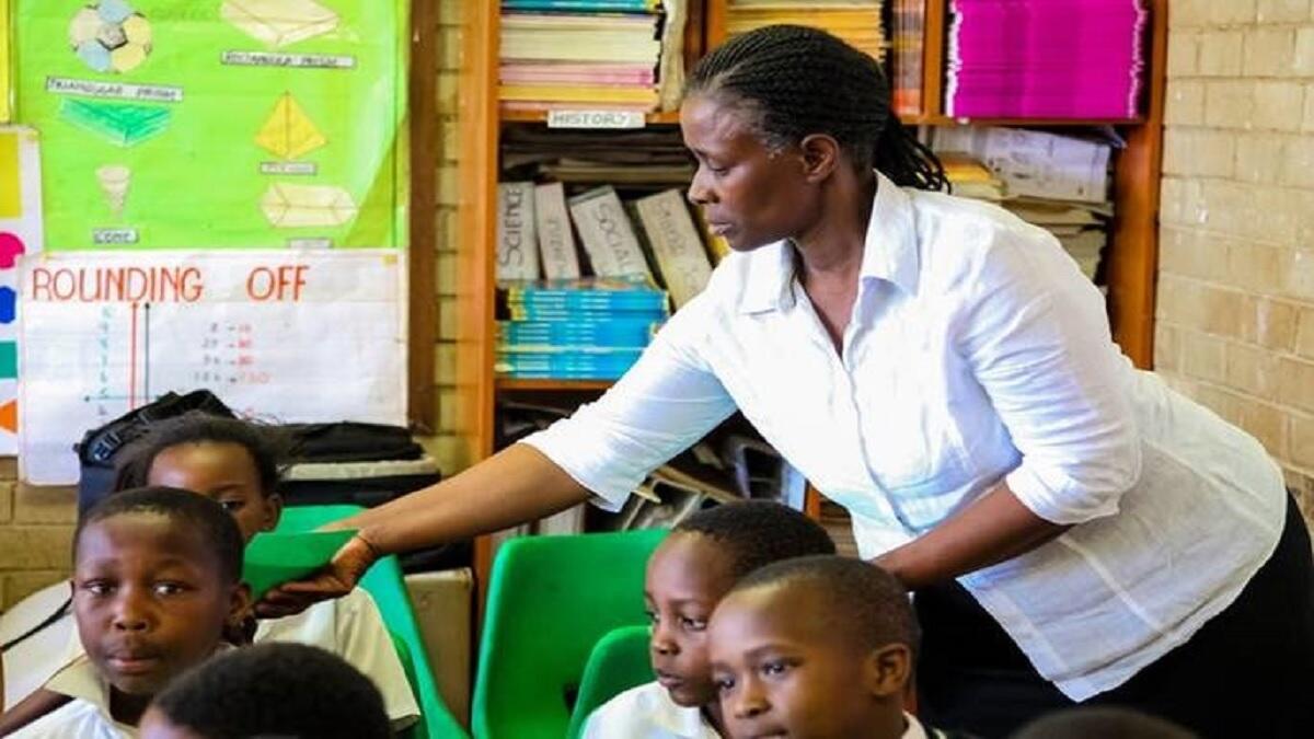Teacher in classroom with pupils
