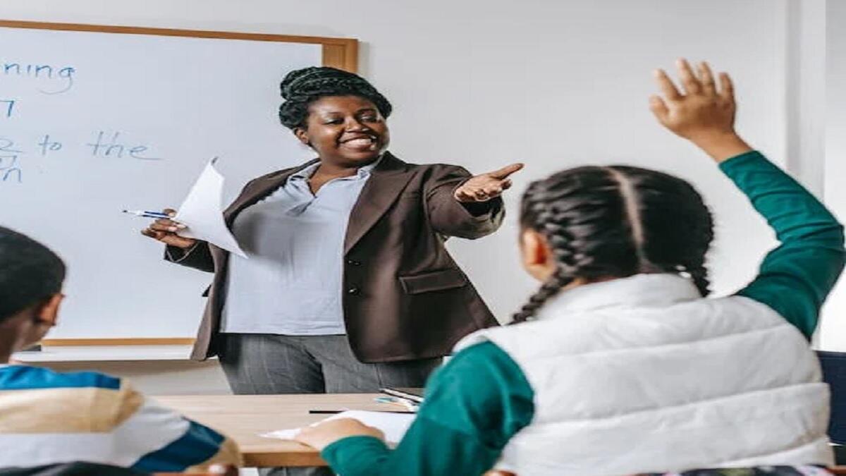 Teacher in classroom with learners