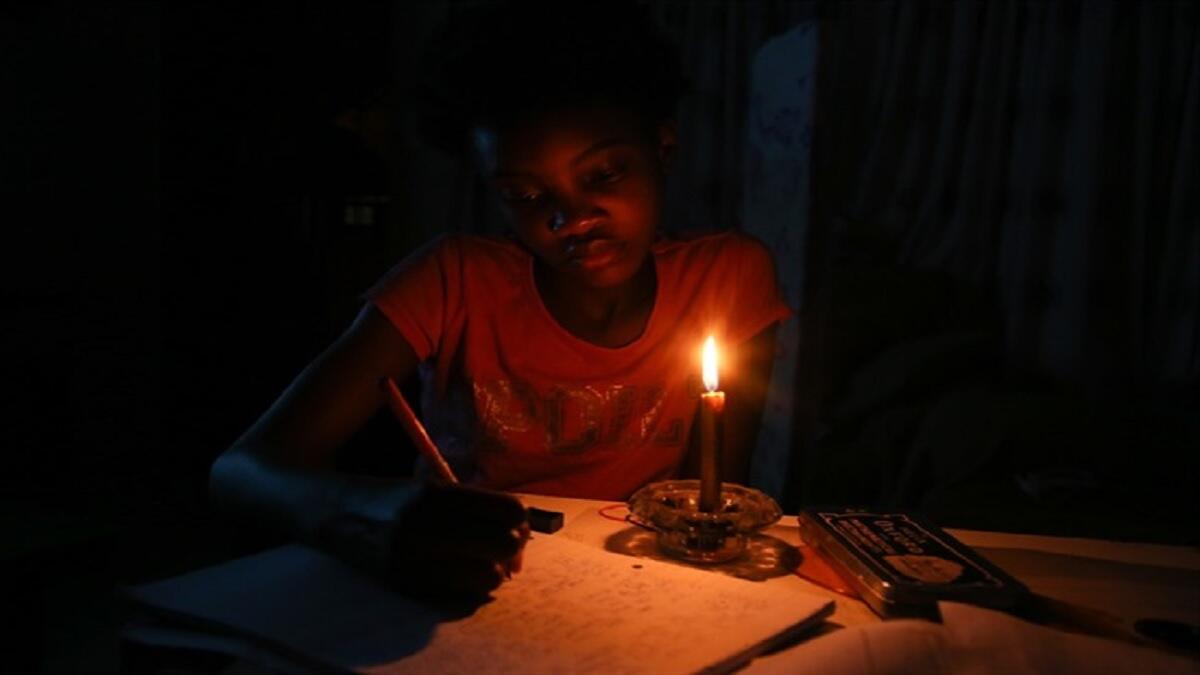 Learner doing home work during loadshedding