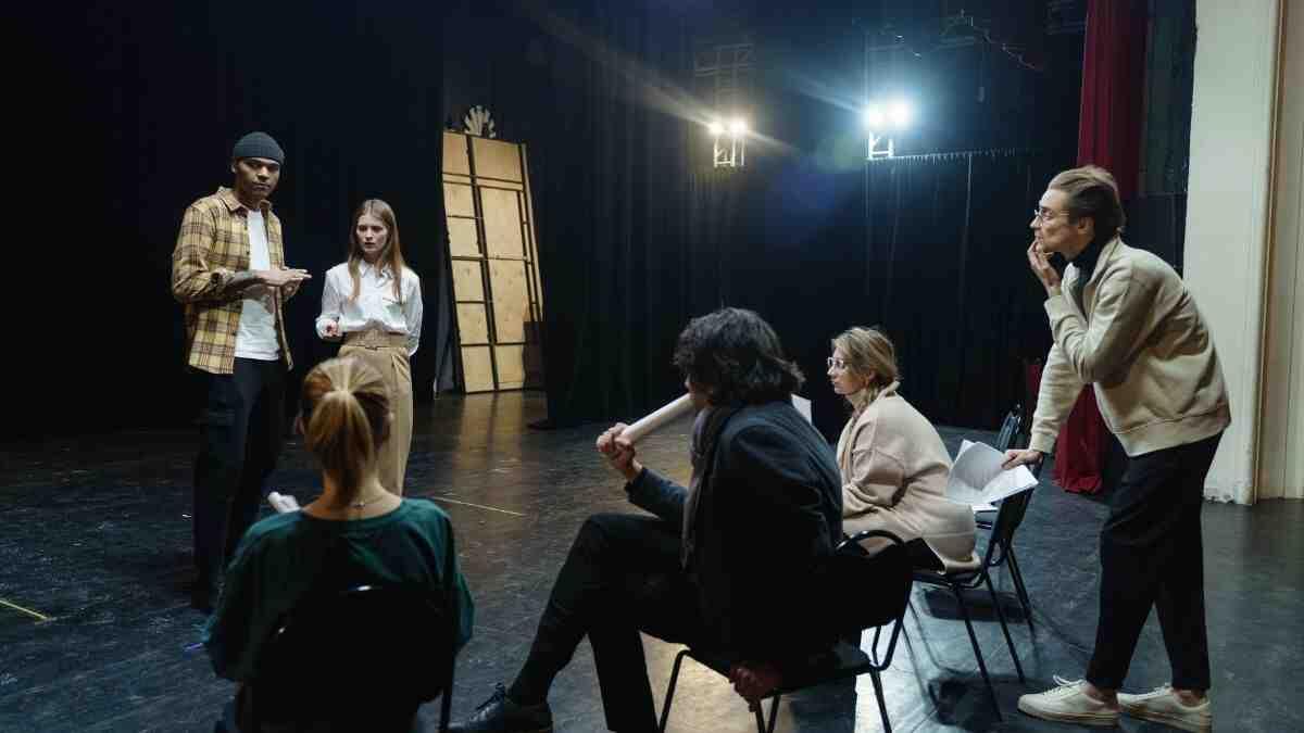 university students in drama class