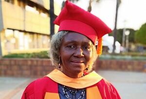 poppy graduate woman gown