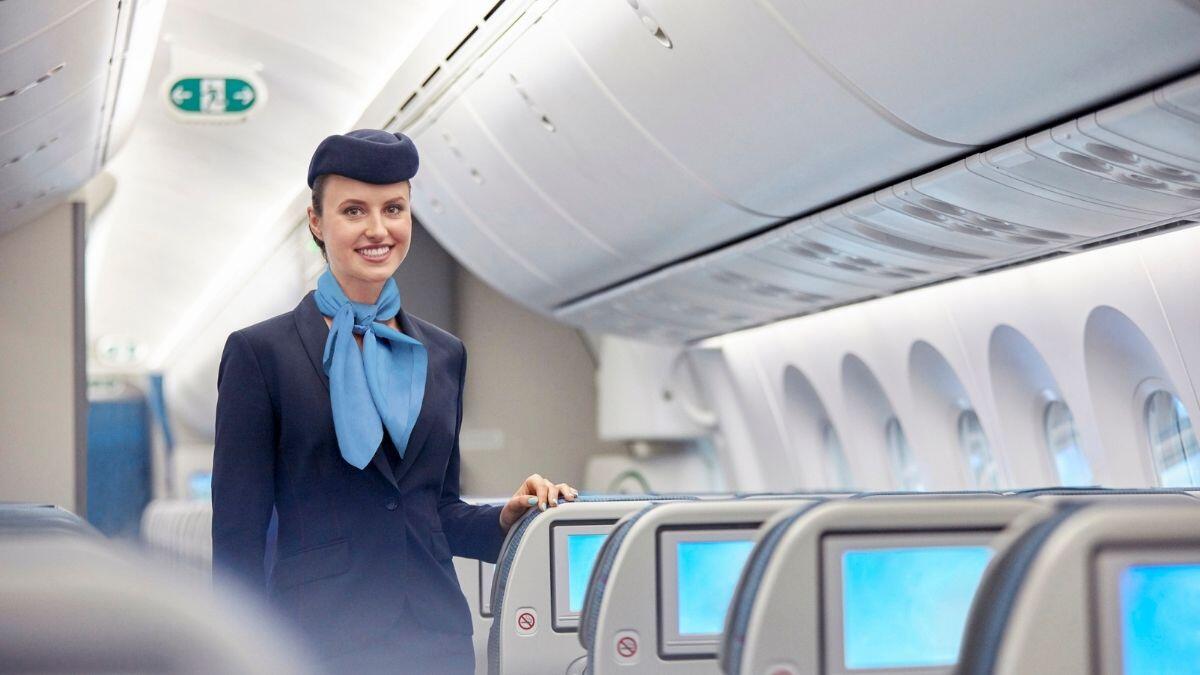 flight attendant posing for a picture