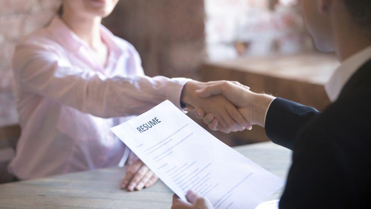 Interviewee and interview shaking hands
