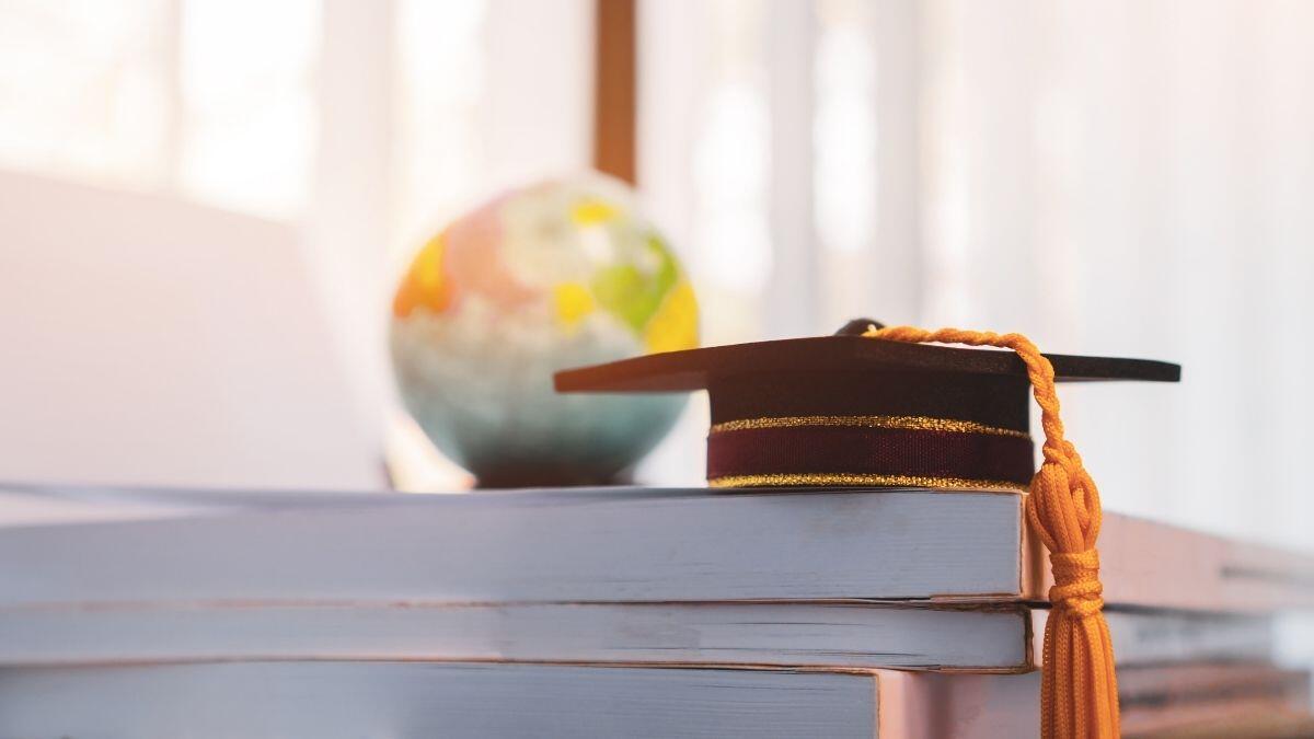 graduation cap and world globe