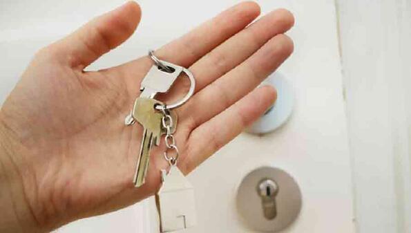 hand holding a key