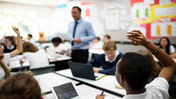 A teaching graduate working in a school he was placed at.