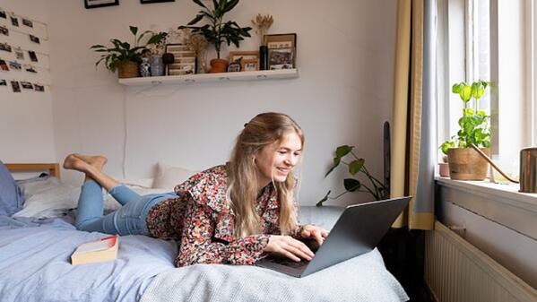 A student in their room at a student accommodation. 