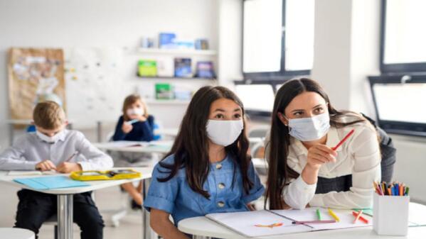 Teacher and student, teacher assistant, education assistant, student in classroom, teacher in classroom 