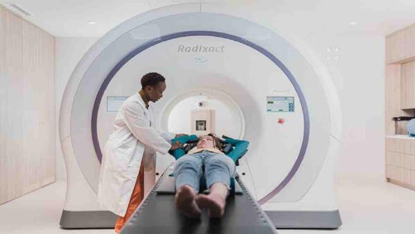 Radiographer working with a patient