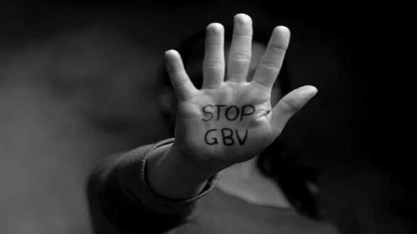 A woman holding her hand up with the message 'Stop GBV'