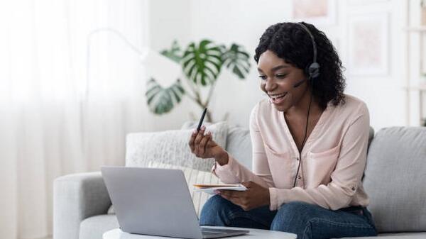 A life coach works with a client online