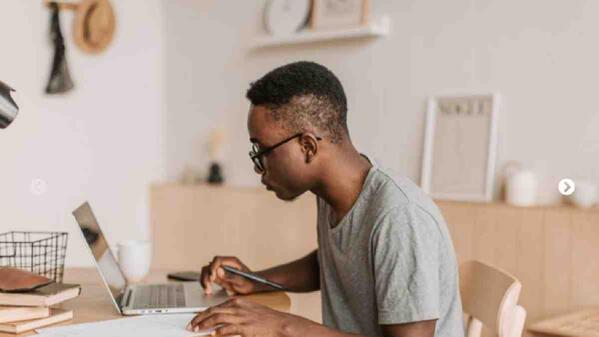 Learner participating in online school from his laptop