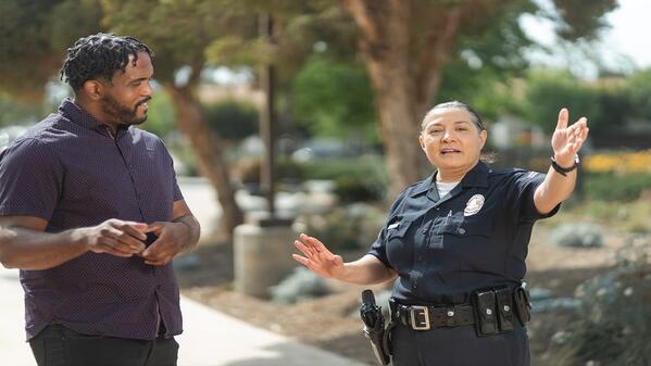 Police officer talking to a man