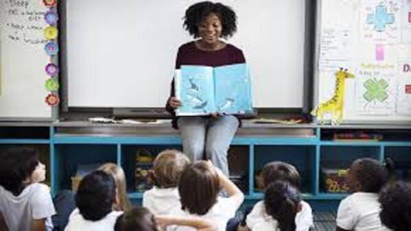 Teaching assistant standing in front of class